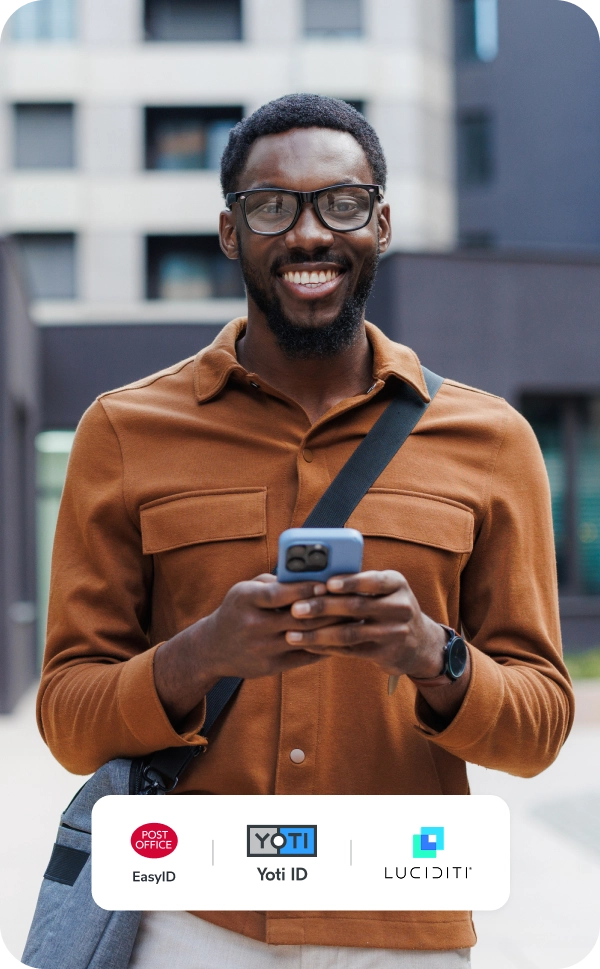 Man smiling holding phone