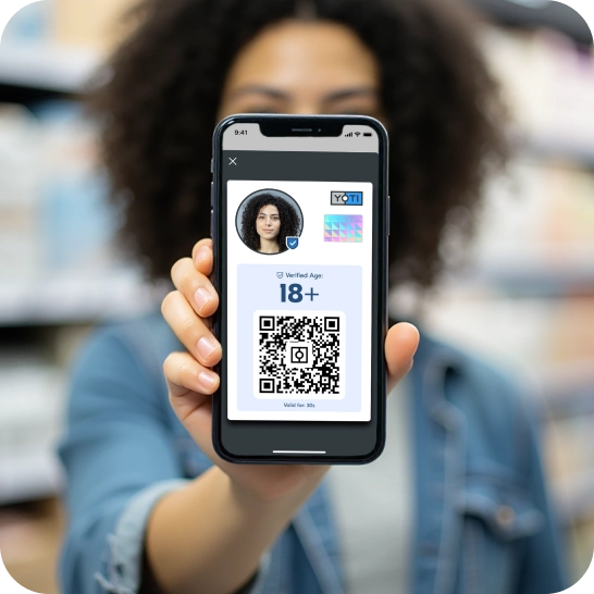 Woman showing her Digital ID showable age card with scannable QR code