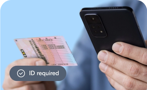Person scanning their UK driving licence with their phone to prove their age