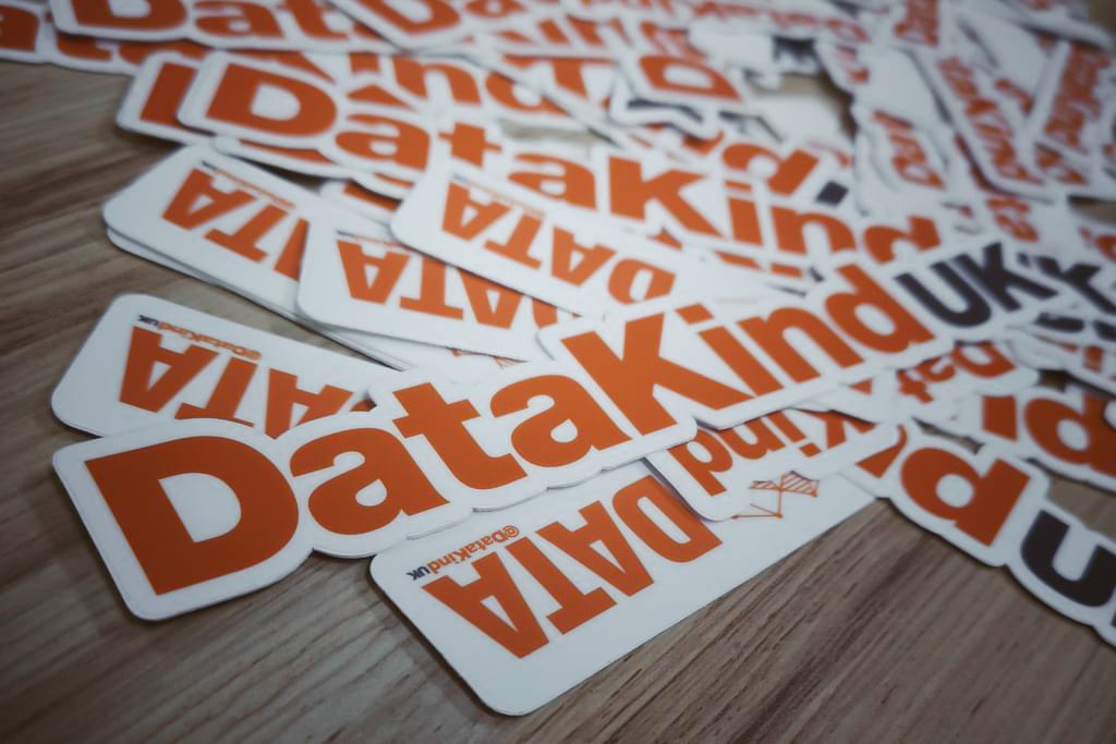 DataKindUK stickers in a pile on the table