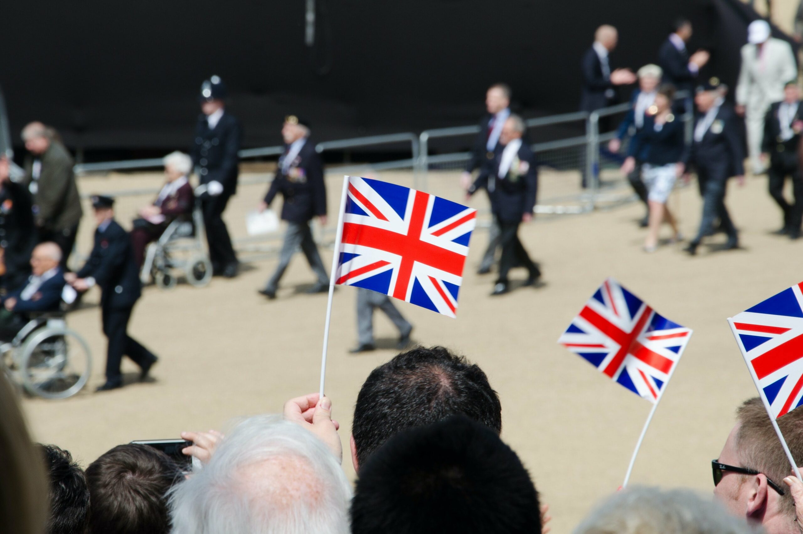 People holding union flags at parade