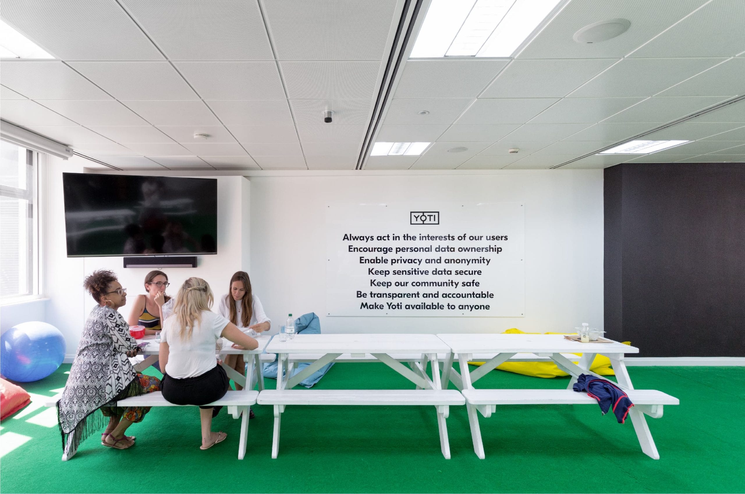 Yoti team members in social area of office