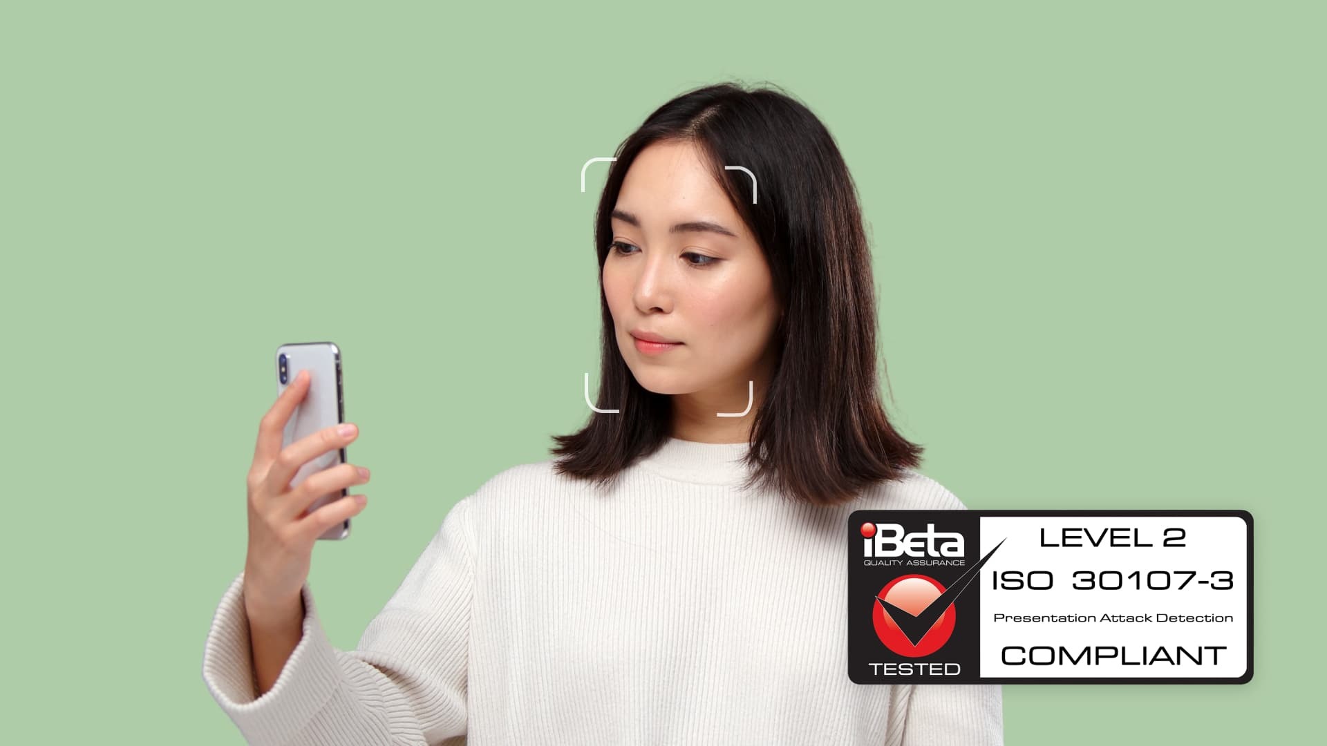 Woman scanning face with the iBeta ISO 30107-3 compliant MyFace software by Yoti