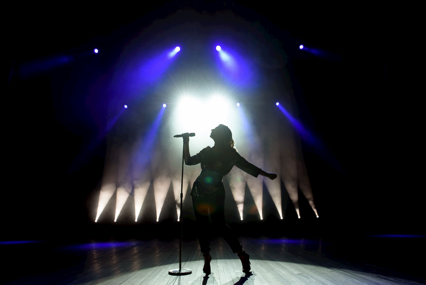 woman on stage performing