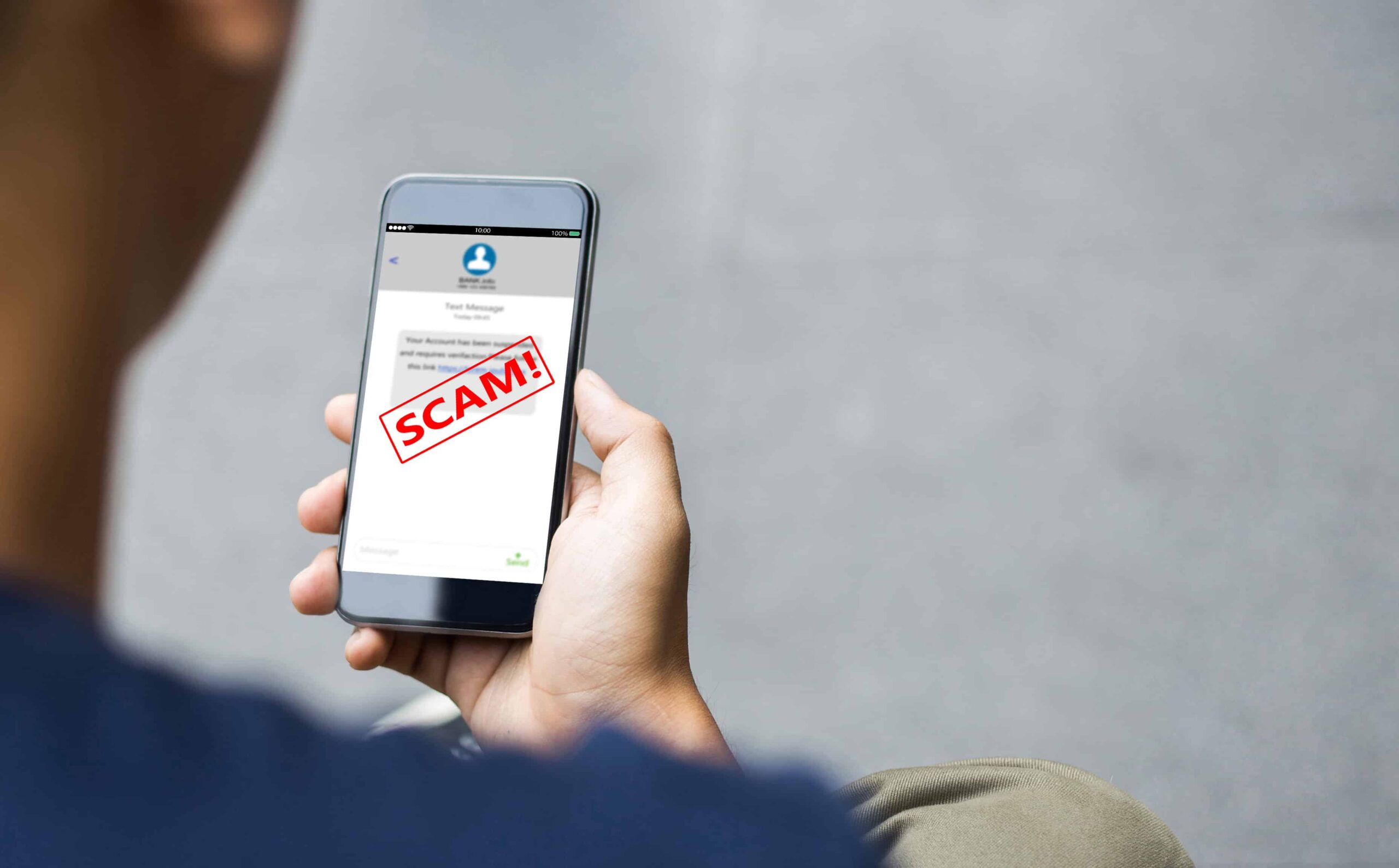 How to stay safe online Person looking at a scam on their phone