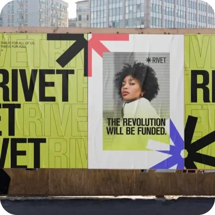 RIVET poster on the walls of a building site in a city