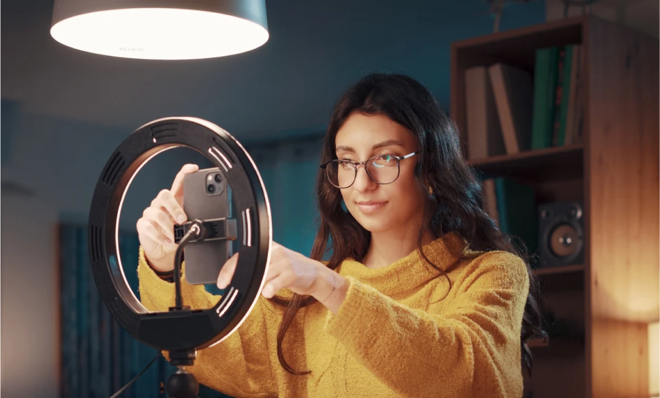 Woman content creator setting up a webcam