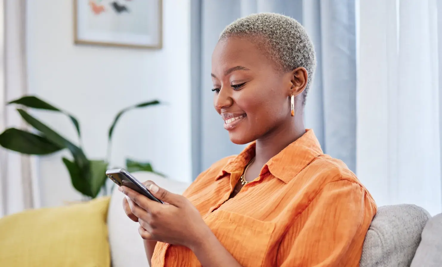 Woman looking at phone and smiling