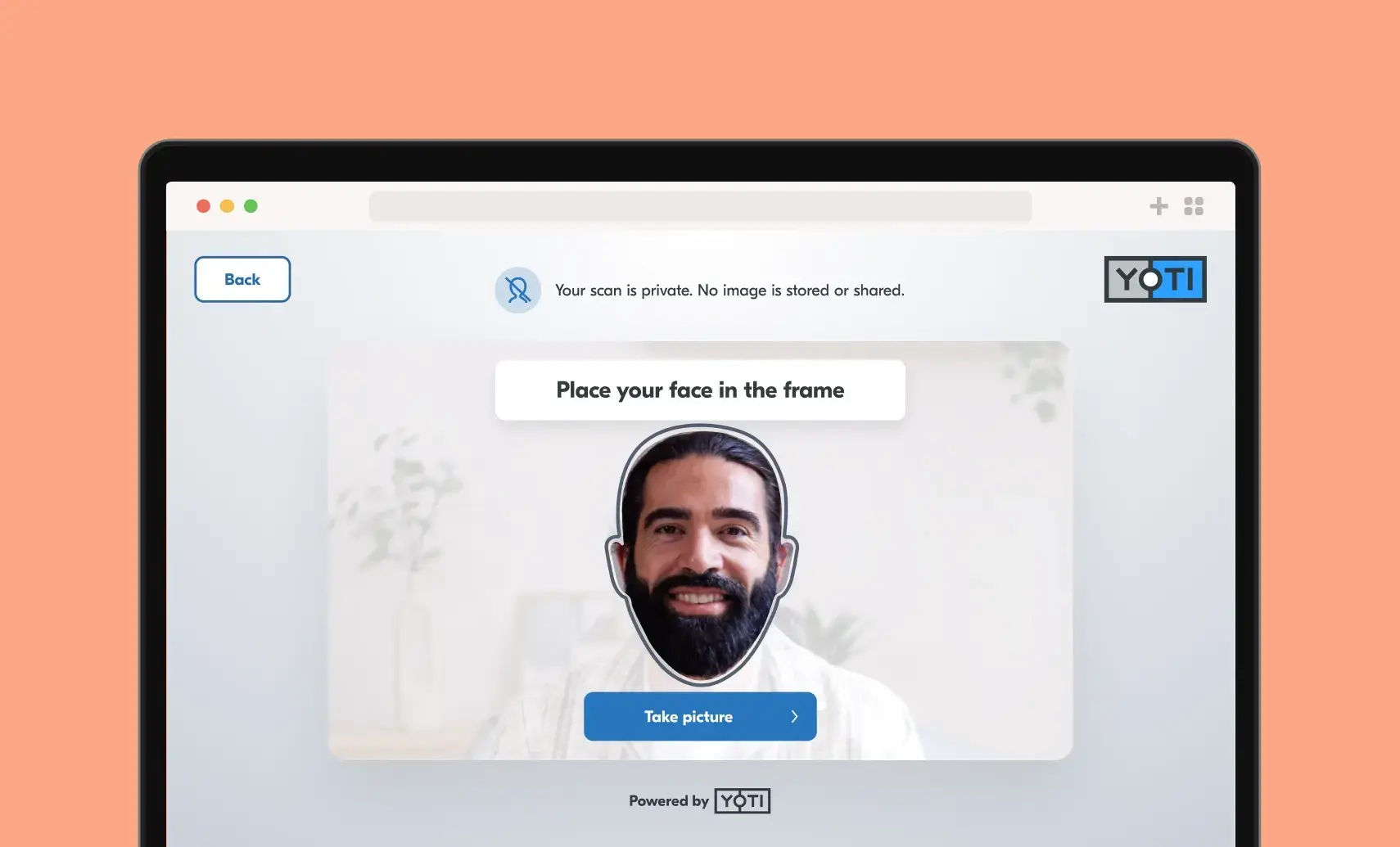 A man placing his face in the frame to perform a facial age estimation with Yoti