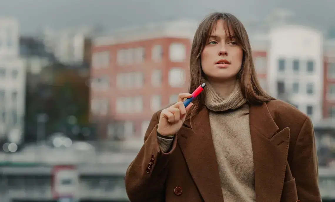 Woman vaping outside