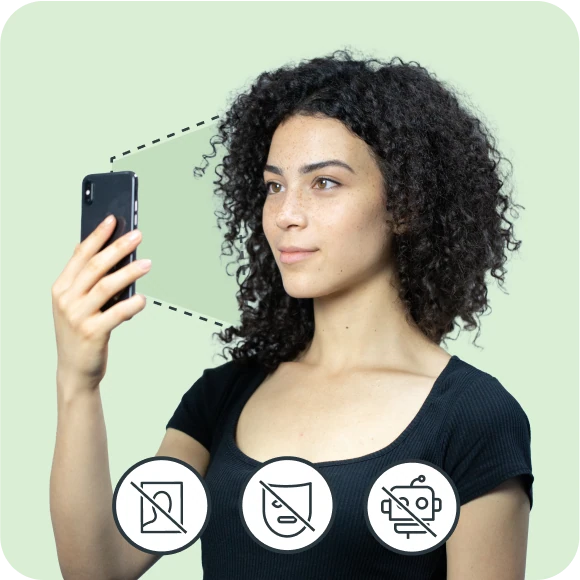 Image of a woman doing a liveness checks with symbols demonstrating they are not a bot, using a printed photo or a mask