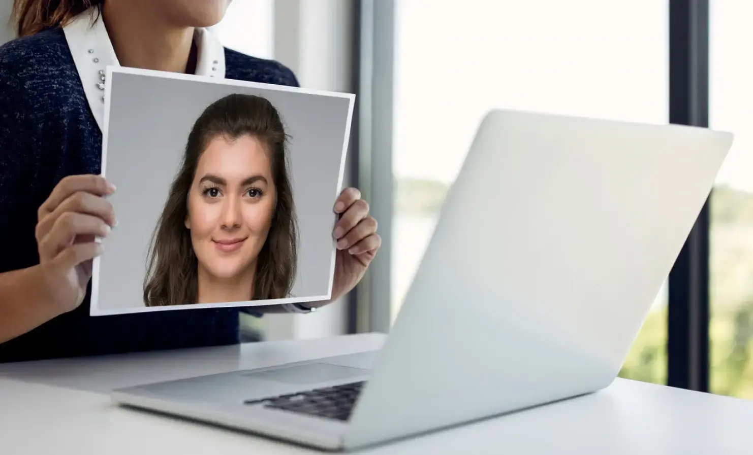 Woman presenting a 2d image trying to perform a presentation attack