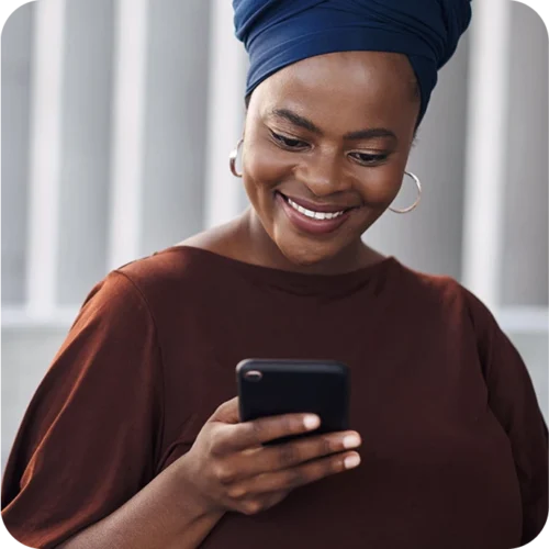 Woman looking at smartphone smiling