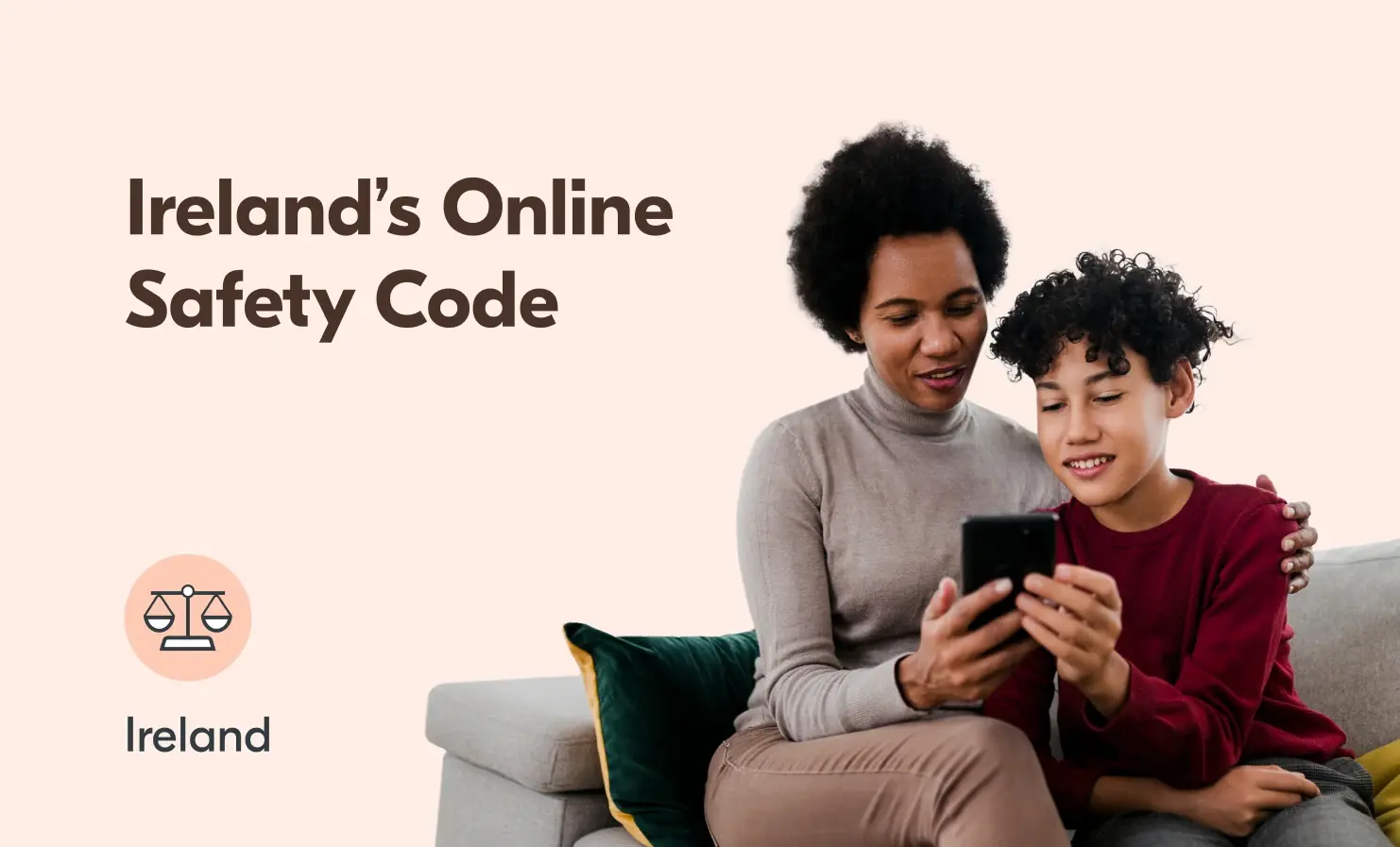 An image of a child and their parent sitting on a sofa and using a mobile phone. The accompanying text reads 'Ireland's Online Safety Code - Ireland'.