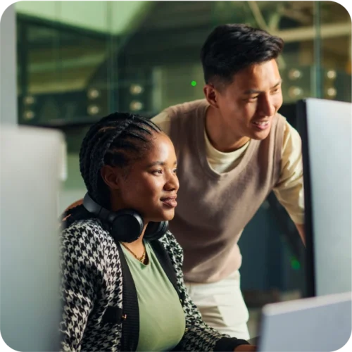 Man and woman at a desktop computer together