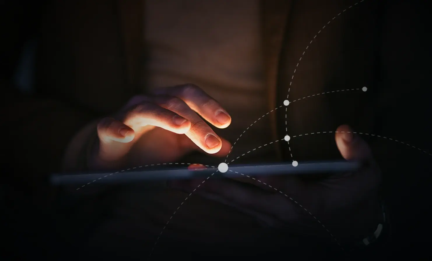 An image showing a person's hands using a tablet device. Several dots connected by dashed lines illustrate the concept of connections or a network.