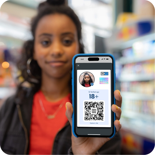 Young woman showing her over 18 age card in the Yoti ID app