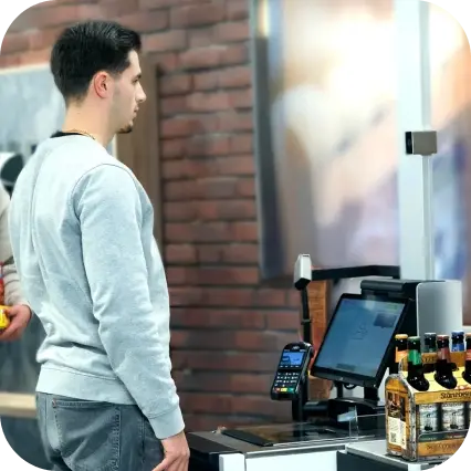 Man buying beers at self-checkout